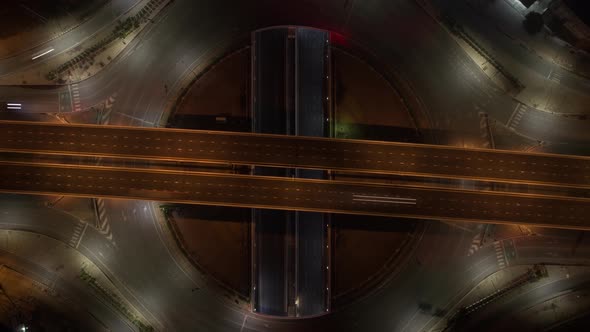 4K : Aerial view shot of fast moving above roundabout