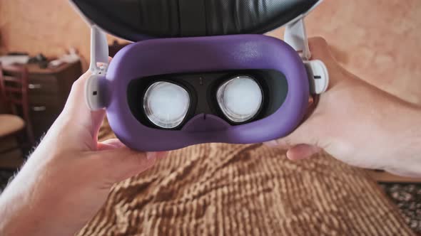 POV of Putting on VR Glasses Virtual Reality in the Bedroom