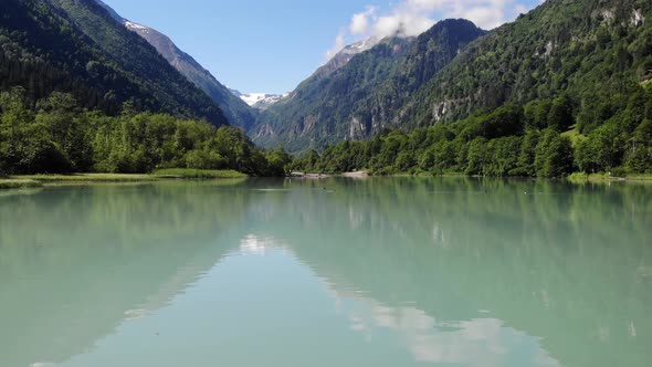 Tranquil Scenery Of Lake With Beautiful Reflections In Kaprun, Austria - aerial shot