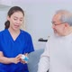 Asian senior male patient consult with physician nurse at nursing home. - VideoHive Item for Sale