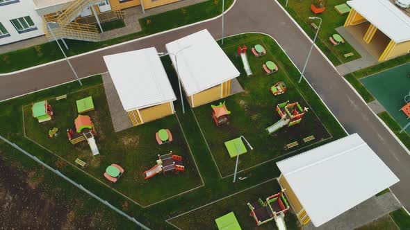 Playgrounds with Attractions and Arbors at Kindergarten