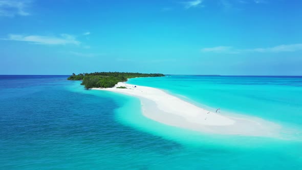 Aerial drone shot panorama of exotic shore beach trip by blue water and white sand background of a d