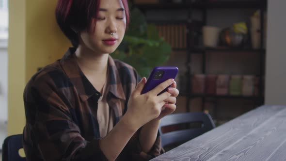 A Young Lady is Talking with Someone on the Phone