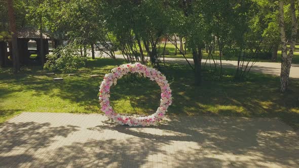 Wedding Venue with Flowers and Empty Chairs in Park Upper