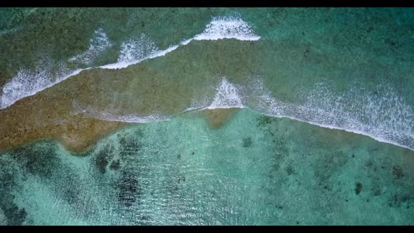 Aerial drone shot tourism of paradise shore beach adventure by blue lagoon and bright sand backgroun