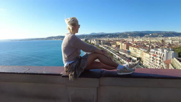 Girl By Nice City Skyline