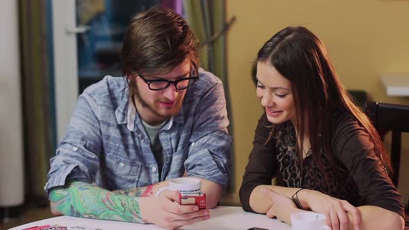 Young Man Woman Couple Chatting Cafe Table Watching Video Phone