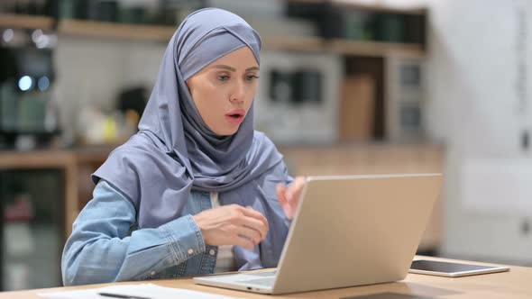 Young Arab Woman with Laptop at Work Coughing