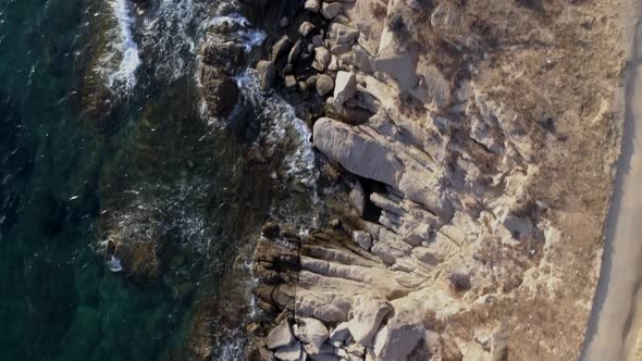 Aerial view above of rock formation on the coast, Greece.