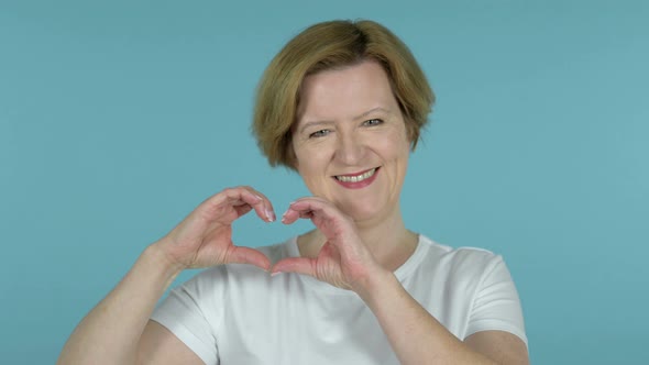 Handmade Heart By Old Woman Isolated on Blue Background