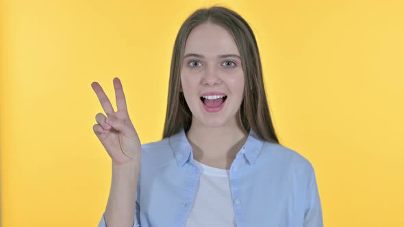 Victory Sign By Casual Young Woman