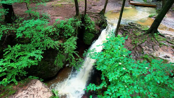 A drone shot of Cascade falls on a sunny day at Nelson-Kennedy Ledges State Park in Northeast Ohio