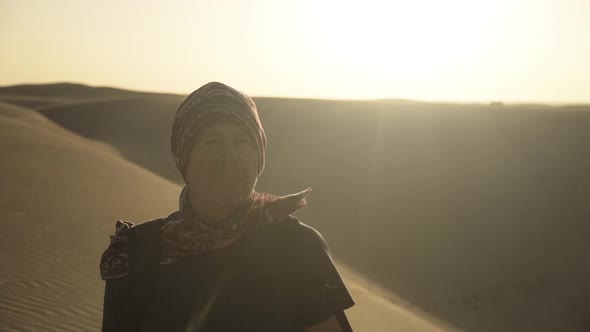 Man In Bandana Walking Through Desert