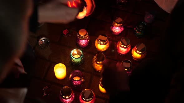 Remembrance Day. Holocaust. Terror Victims Memorial. Hands Lighting Candles. Burning Candles