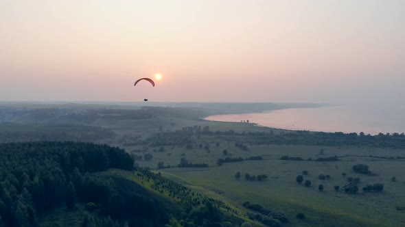 Flying Sportsman Floats on a Glider. Adventure, Active Extreme Lifestyle Concept.