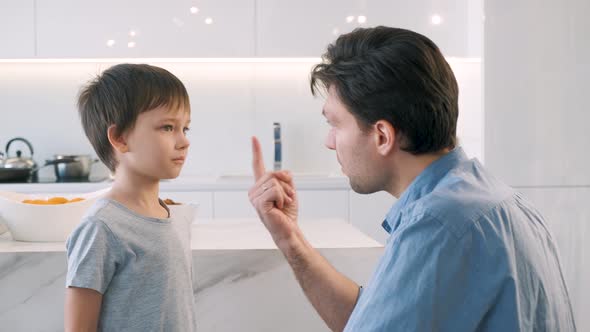 Father Scolds His Son for Bad Behavior