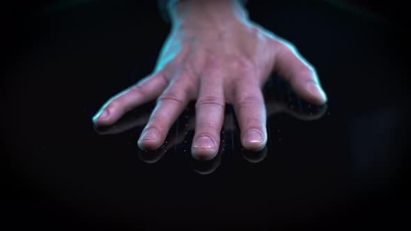 Crop Man Scanning Hand on Biometric Panel