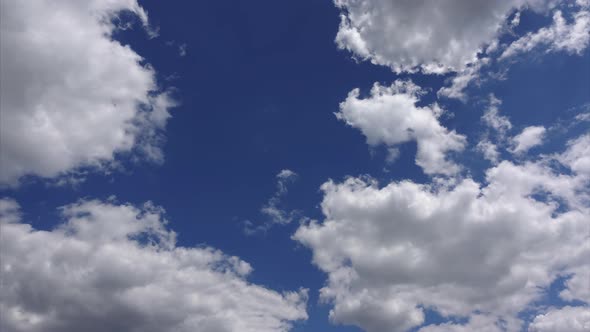 Beautiful Cloudscape, Timelapse . Amazing White Clouds in the Blue Sky in Sunlight