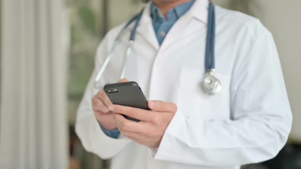 Close Up of Doctor Typing on Smartphone