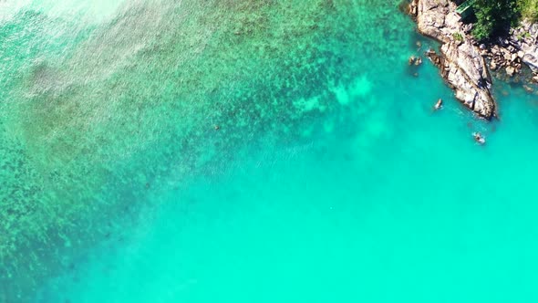 Aerial above texture of beautiful shore beach vacation by shallow ocean and white sandy background o