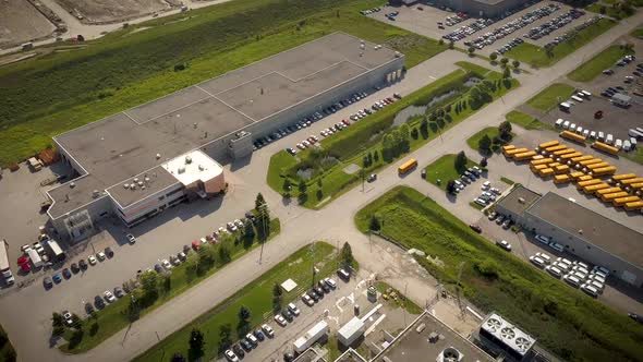 Drone flying over street in an industrial district.