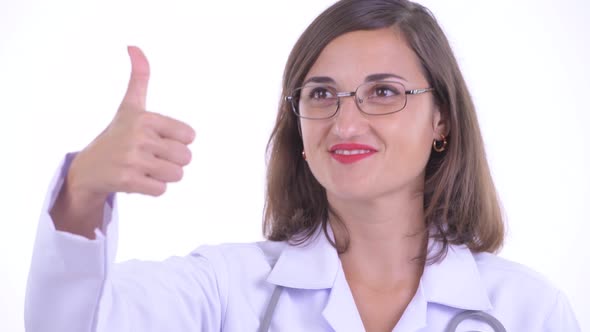 Face of Happy Beautiful Woman Doctor Giving Thumbs Up