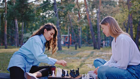 Handsome Ladies in a Modern Park at Fresh Airs