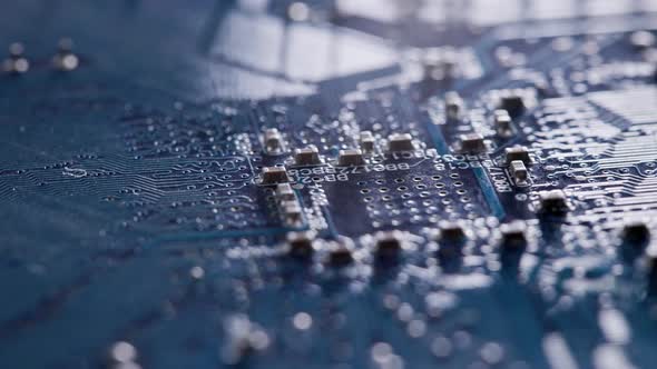 Computer Electronic Circuit Board with Radial Conductor Tracks and SMD Capacitors Rotating Macro