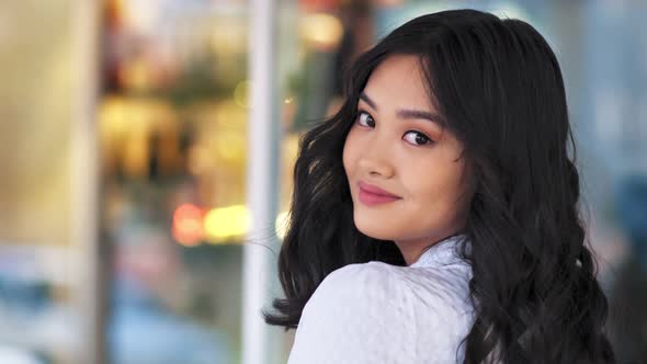 Portrait Smiling Asian Young Woman Having Fun Posing and Looking Around Turning Head