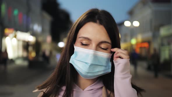 Young Hispanic Woman Wearing Protective Mask Against COVID Virus Tourist with Medical Mask Public