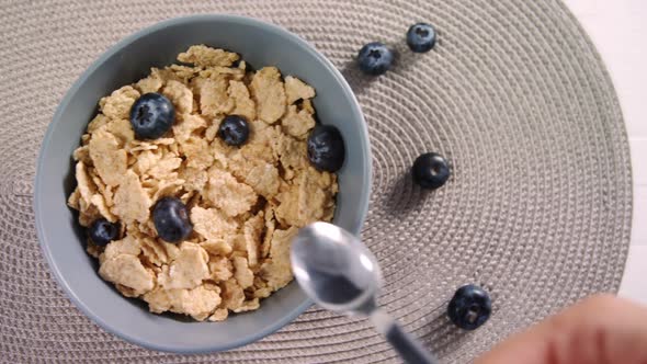 Bowl of wheat flakes and blueberries 4k