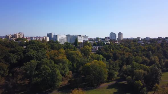 Aerial drone video of cityscape in middle of the day during autumn season
