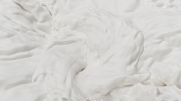 Super Slow Motion Shot of Swirling Fresh Milk at 1000 Fps alt