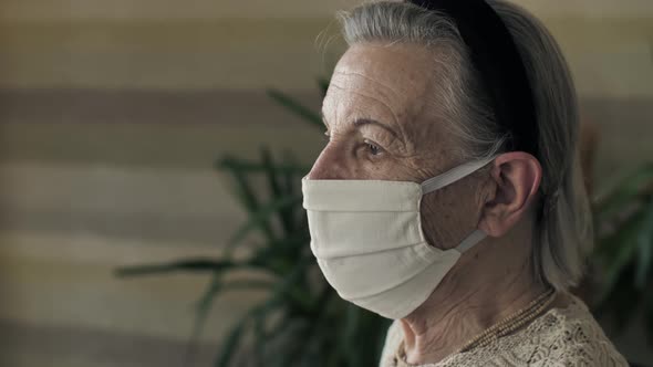 Portrait of Old Woman in Face Mask on Quarantine