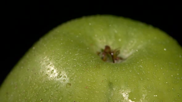 Top of Green Apple Isolated on Black, Rotation Close Up