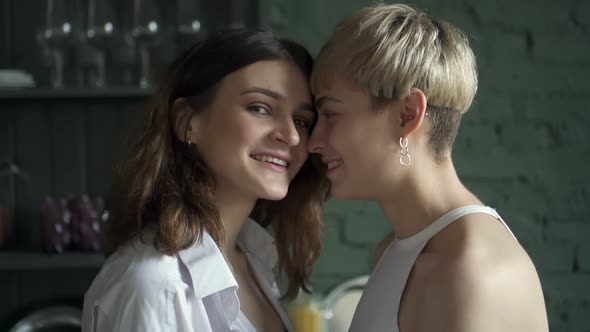 Portrait of Young Happy Lesbian Young Womans Posing in Front of Camera in Interior