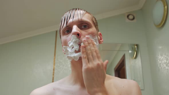 Man Applies Shaving Foam