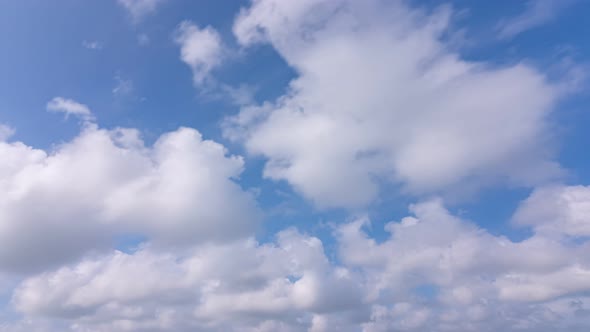 Summer Clouds background.Blue sky white clouds Cloudscape timelapse Amazing summer blue sky