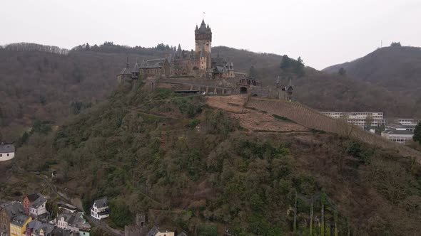 drone flight looking up to the castle of the town of cochem in germany's Rhineland Palatinate