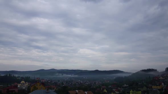 Morning Fog in Mountains Village Time Lapse of Cloudy Morning