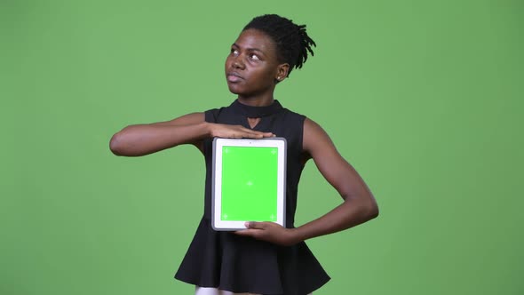 Young Beautiful African Businesswoman Showing Digital Tablet