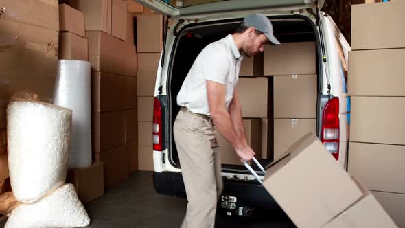 Delivery Driver Packing his Van