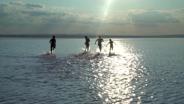 Happy Kids Are  Running On The Salt Lake