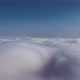 Aerial View From Airplane Window at High Altitude of Earth Covered with White Puffy Cumulus Clouds - VideoHive Item for Sale