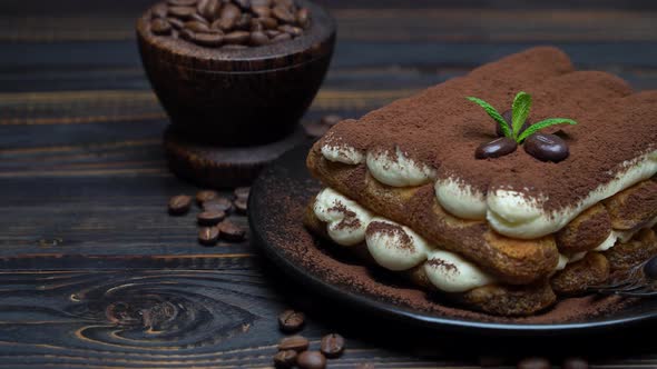 Classic Tiramisu Dessert on Ceramic Plate on Wooden Background