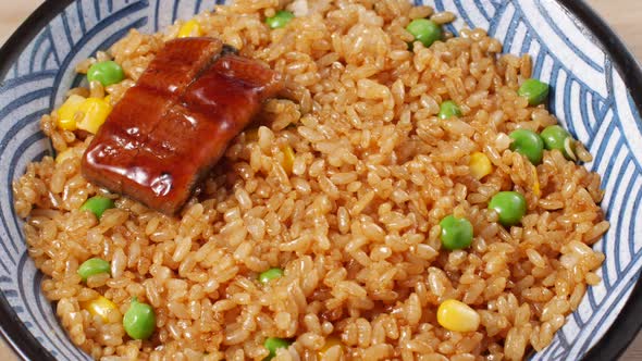 Unagi fish fillet placed on rice in a bowl - Japanese food cuisine