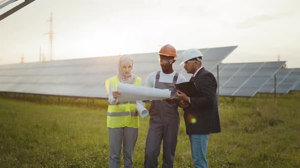 African American Technician Muslim Woman and Indian Man Standing Together on