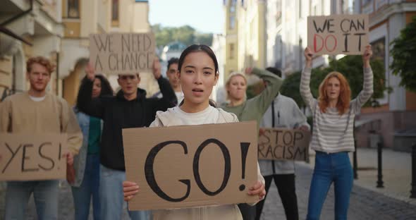 Students Activists at City Streets with Posters