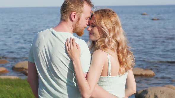 Romance on Vacation: Couple in Love on the Beach Flirting