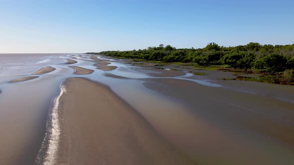 Aerial tranquil natural landscape capturing the unspoiled riverbanks and coastal woodland in Rio de